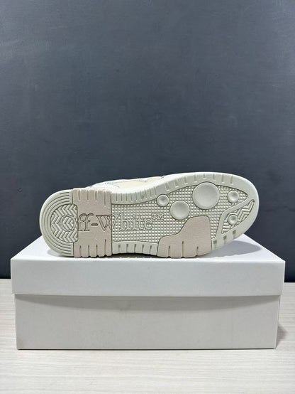 Underside of the sneaker showing the textured cream-white rubber outsole and tread pattern.