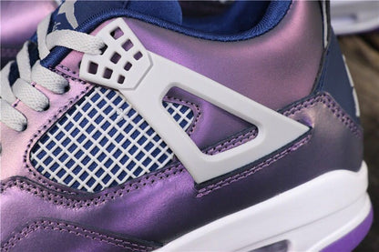 Close-up of the white side wing support, mesh panel, purple-blue upper, and visible stitching.
