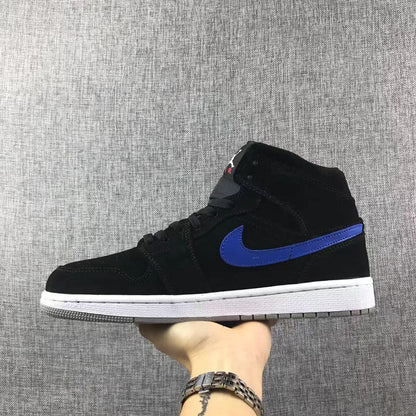 Side view showing the black Jordan 1 Mid upper with a blue Swoosh and white midsole.