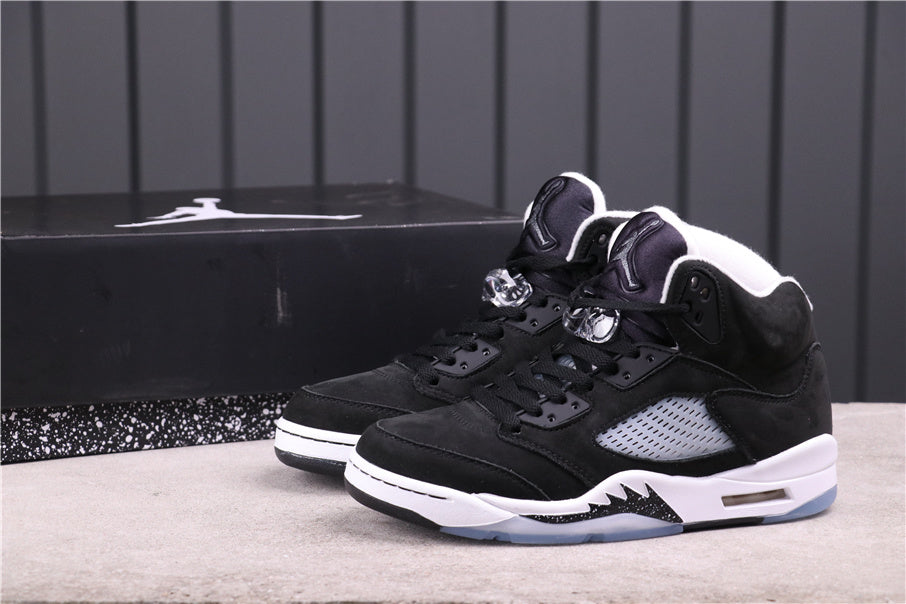 Pair of black and white Jordan high-top sneakers shown from a front three-quarter angle.