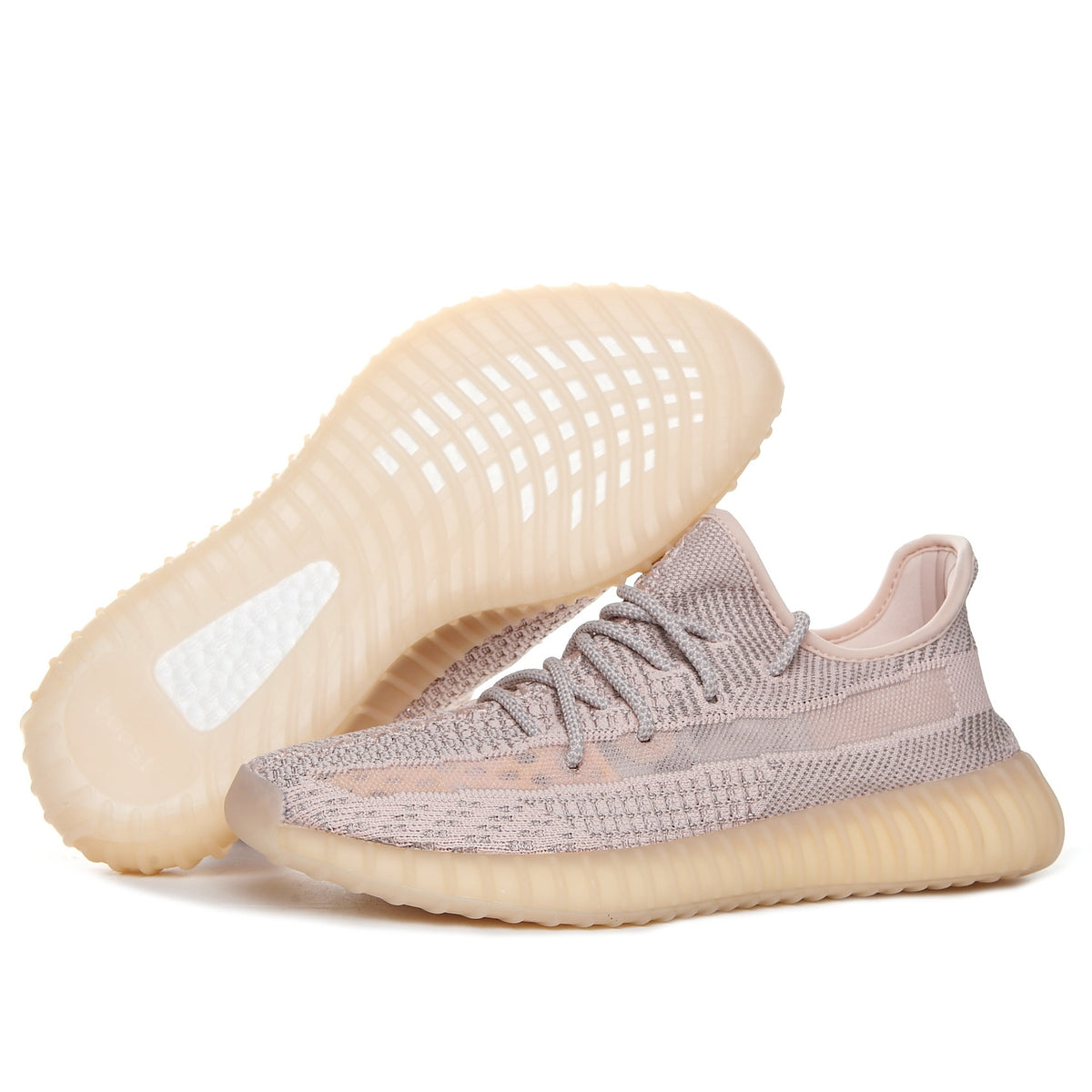 Side view of taupe-pink knit sneakers with tonal laces, woven upper, and translucent ribbed outsole.