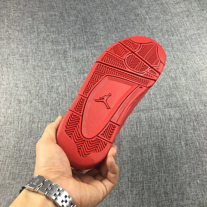 Red outsole with herringbone-style traction sections and a raised Jordan logo.