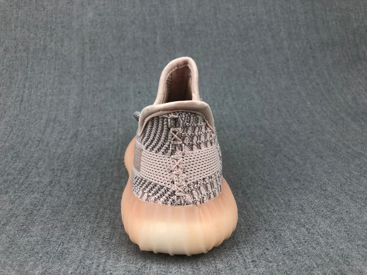 Rear view showing the padded collar, heel construction, and translucent sole.