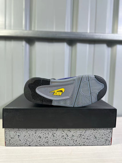 Outsole view of a Jordan Air Jordan 4 sneaker showing grey and black patterned traction sections with a yellow logo.