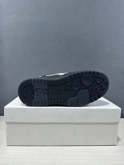 Close view of the black outsole showing its textured tread pattern and embossed branding.