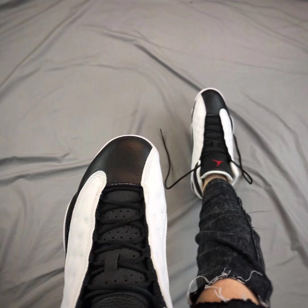 Top-down view showing black laces, perforated tongue, and white side accents.