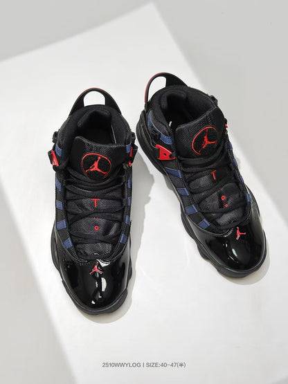 Top view showing the black lacing system, padded tongues, navy panels, and red Jordan details.