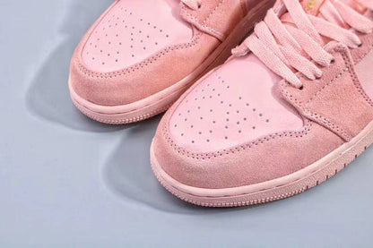 Close-up of the perforated pink toe boxes and textured toe overlays.