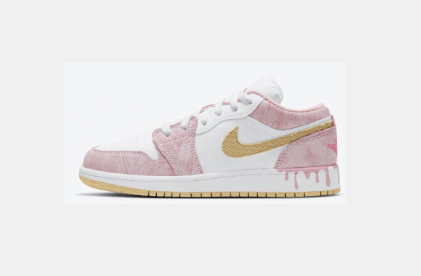 Pink and white low-top sneaker with a gold-toned Swoosh, white laces, and a light outsole with a gum-colored tread section.