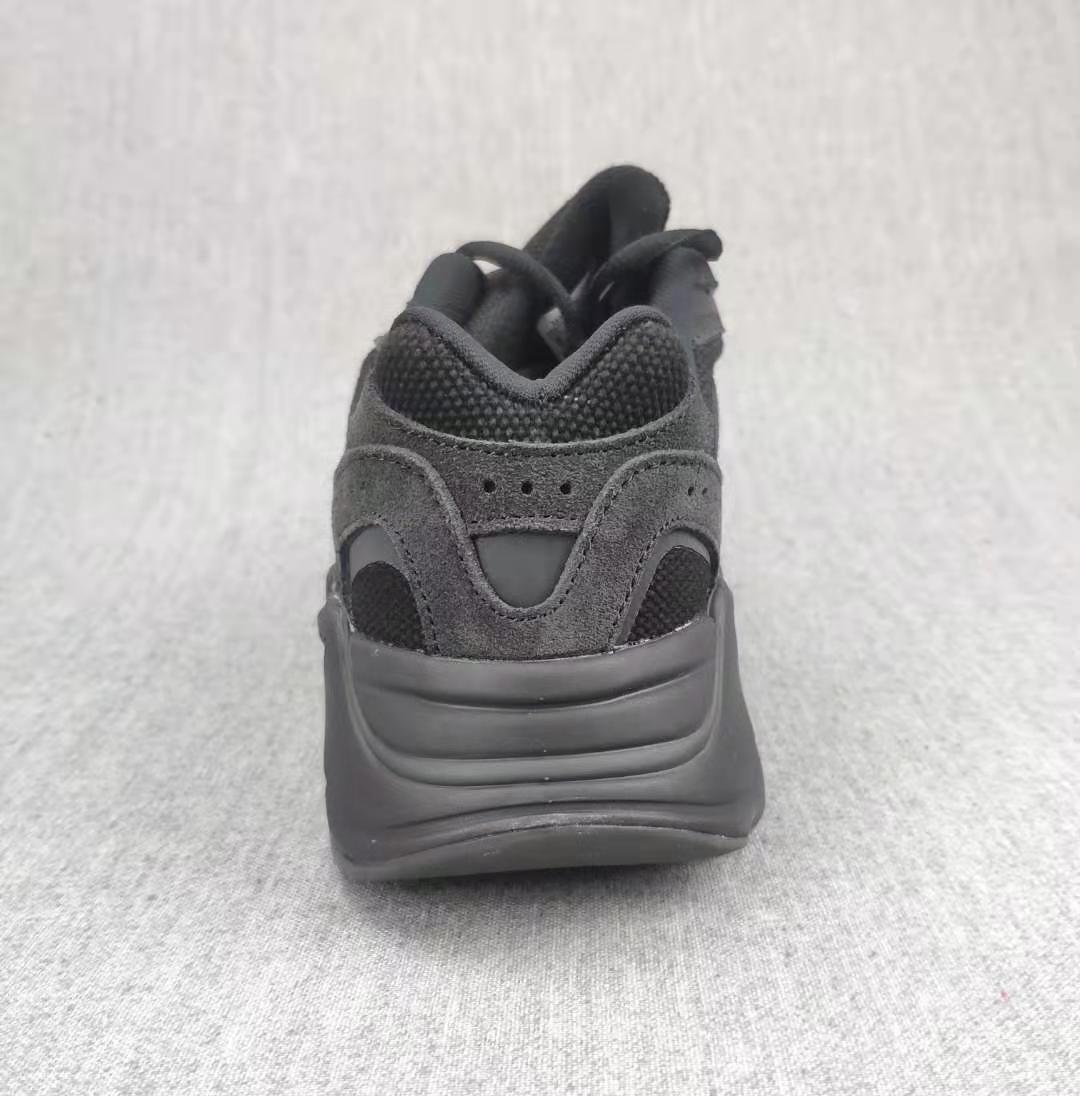 Rear view showing the padded heel collar and sculpted dark midsole.