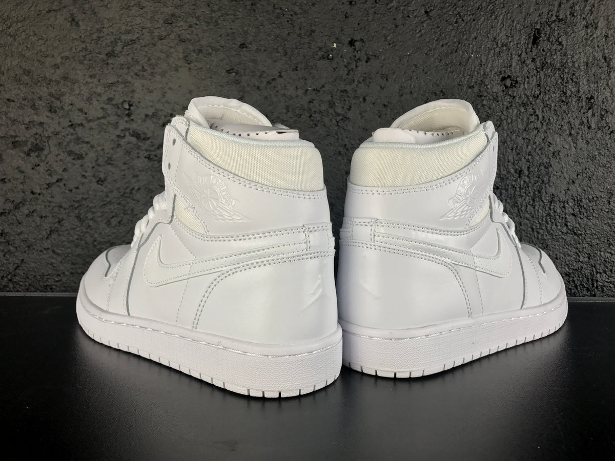 Rear view of the pair showing the Jordan Wings emblems, heel panels and white rubber soles.