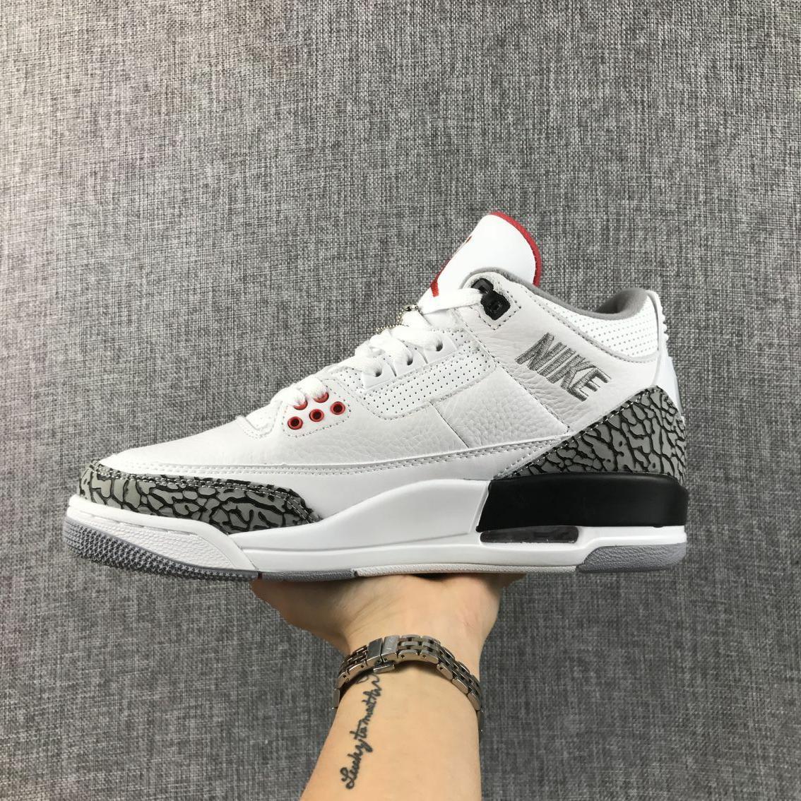 Side view highlighting the visible Swoosh, perforated collar, grey elephant print, and black midsole section.