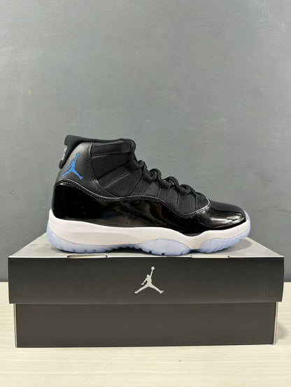 Side profile of a single black and blue high-top sneaker placed on a Jordan shoebox.