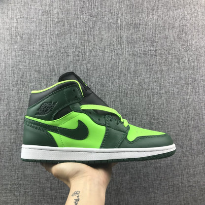 Side view of a Jordan 1 Mid sneaker in dark green and fluorescent green with a white midsole.