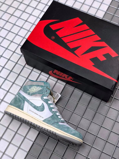 Air Jordan 1 high-top sneaker beside a black and red shoebox, showing the teal-green and white color scheme.