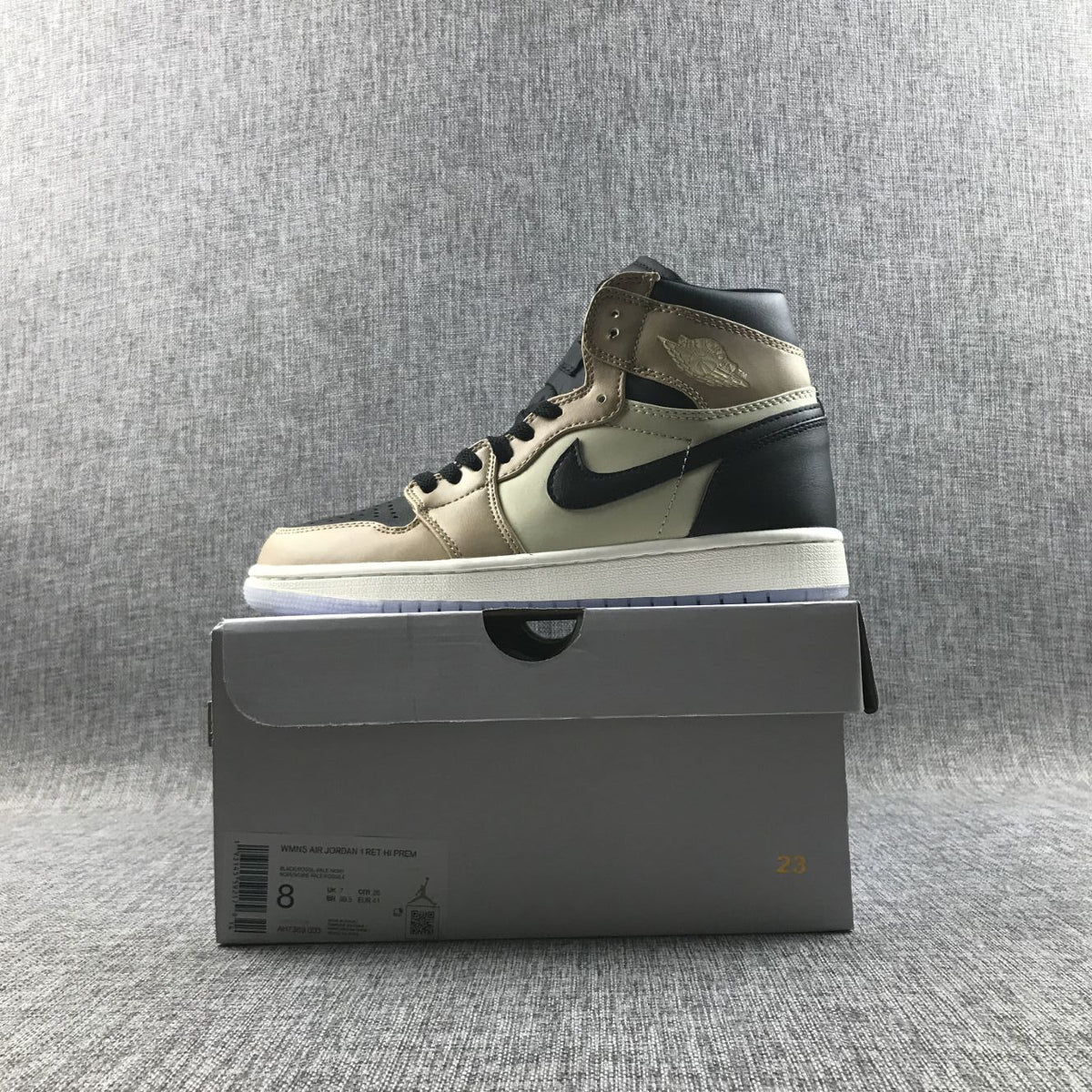 Side view of one sneaker displayed on its shoebox.