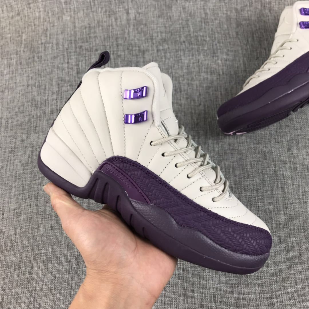 Side view of an off-white and deep purple Air Jordan 12 sneaker
