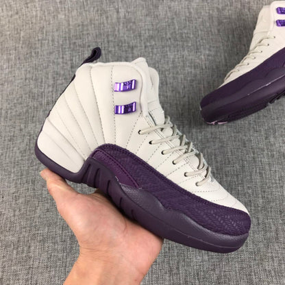 Side view of an off-white and deep purple Air Jordan 12 sneaker