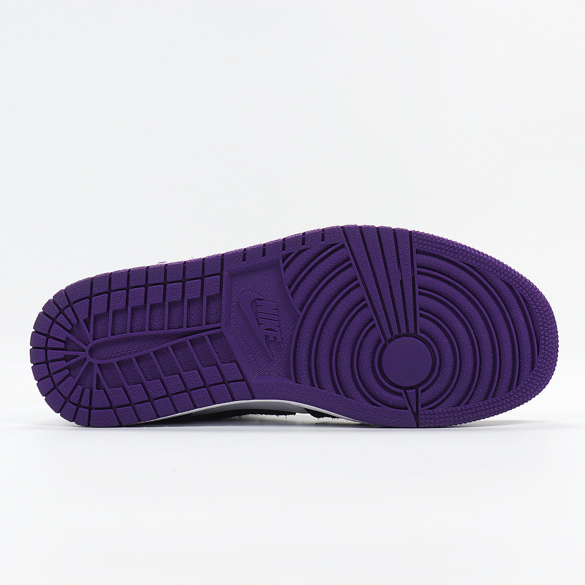 Underside view showing the purple rubber outsole and circular traction pattern.