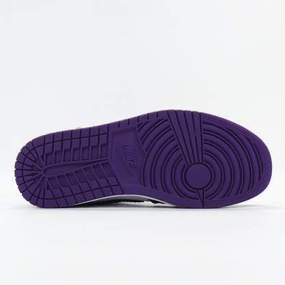 Underside view showing the purple rubber outsole and circular traction pattern.
