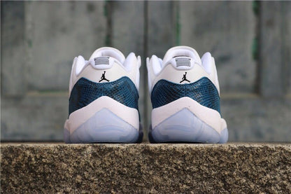 Rear view of the pair showing navy heel panels, white midsoles, and translucent outsoles.