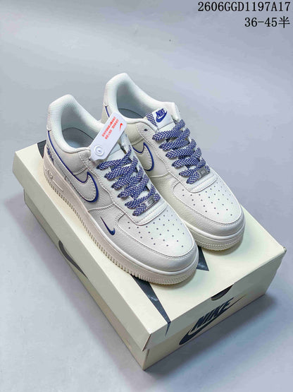 Nike Air Force 1 Low x Stüssy White and Navy Sneakers