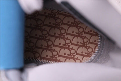Close-up of the insole featuring a repeating Dior-style monogram pattern.