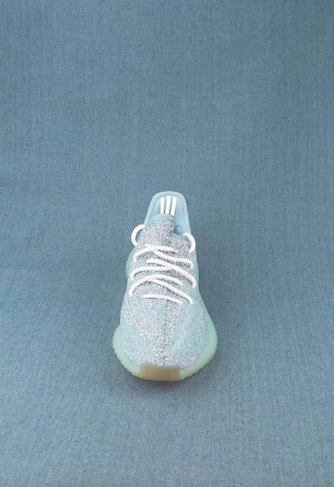 Front view of a pale icy lace-up sneaker with a shimmering upper.
