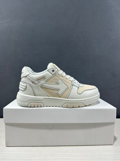 Side profile of a cream-white Off-White low-top sneaker displayed on a white box.