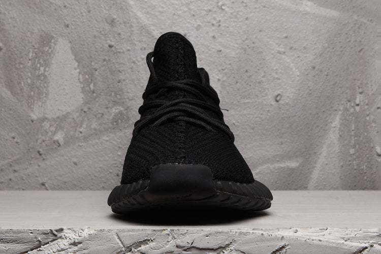 Front view showing the rounded toe, lacing structure, and black upper.