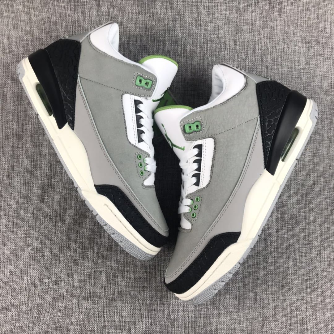 Two gray Air Jordan 3 sneakers arranged side by side to show their outer sides, black heel overlays, and light midsoles.