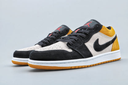 Three-quarter view of the pair showing black laces, light perforated toe boxes, and yellow outsoles.