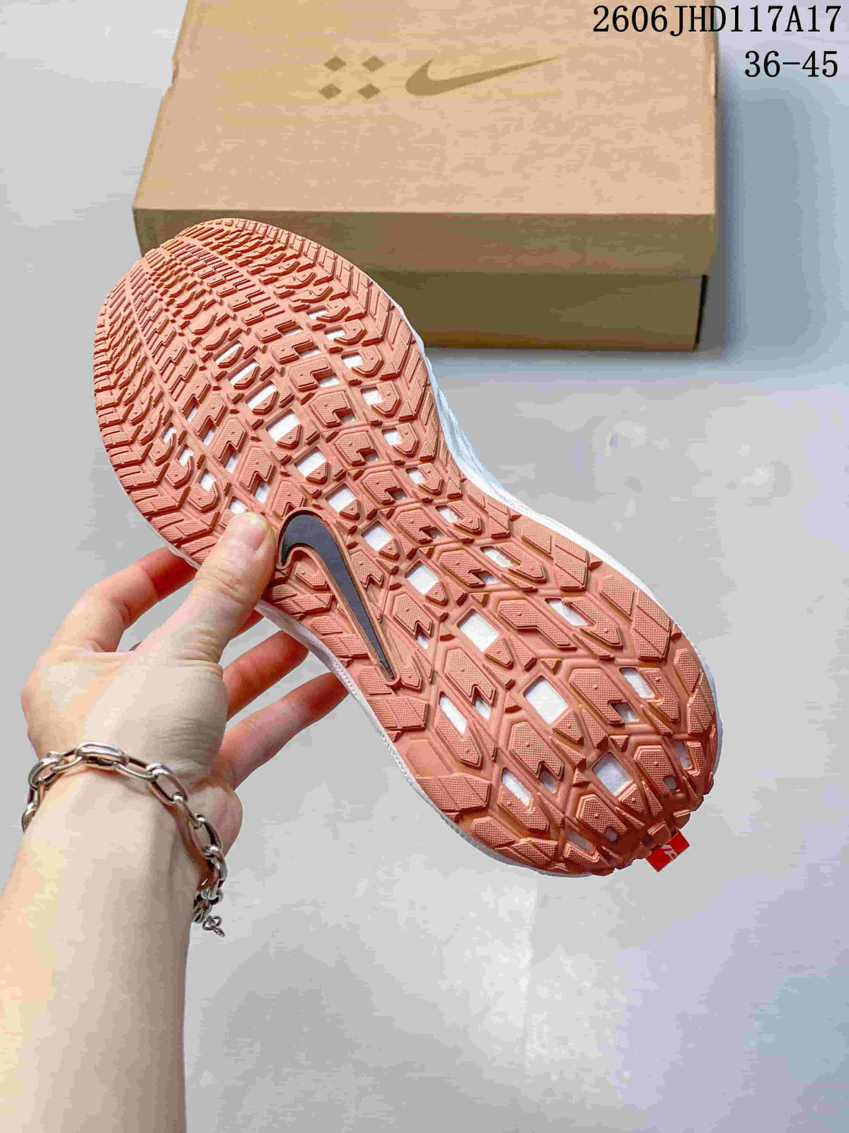 Nike Ava Rover Low-Top Sneakers in White and Coral