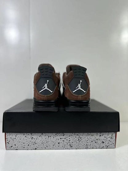 Rear view of the brown and black sneakers showing black heel panels and contrasting white logos.