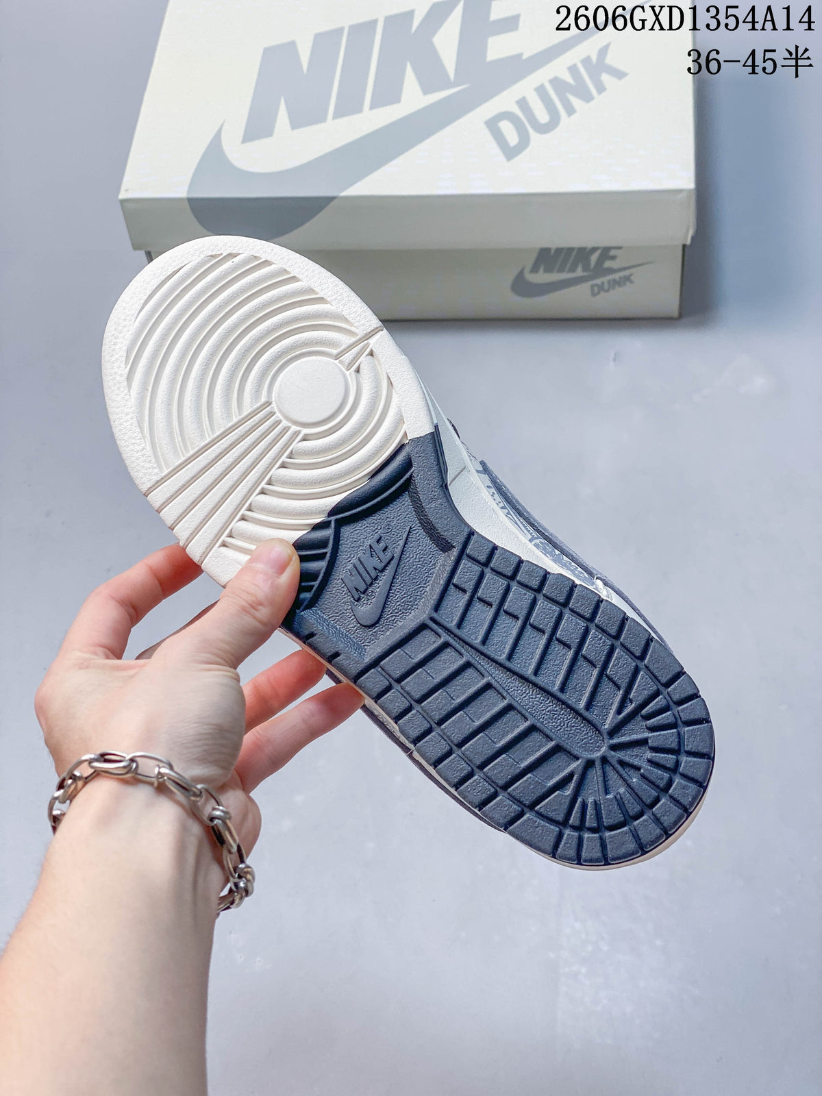 Nike Dunk Low x Undefeated Sneakers in White and Navy