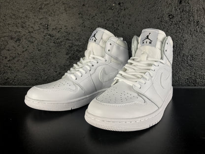 Front three-quarter product view of the white pair with Jordan tongue labels, laces and perforated toe boxes.