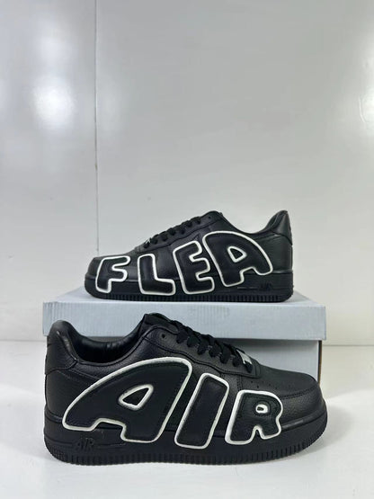 Two black low-top sneakers shown from side angles with large outlined AIR and FLEA lettering.