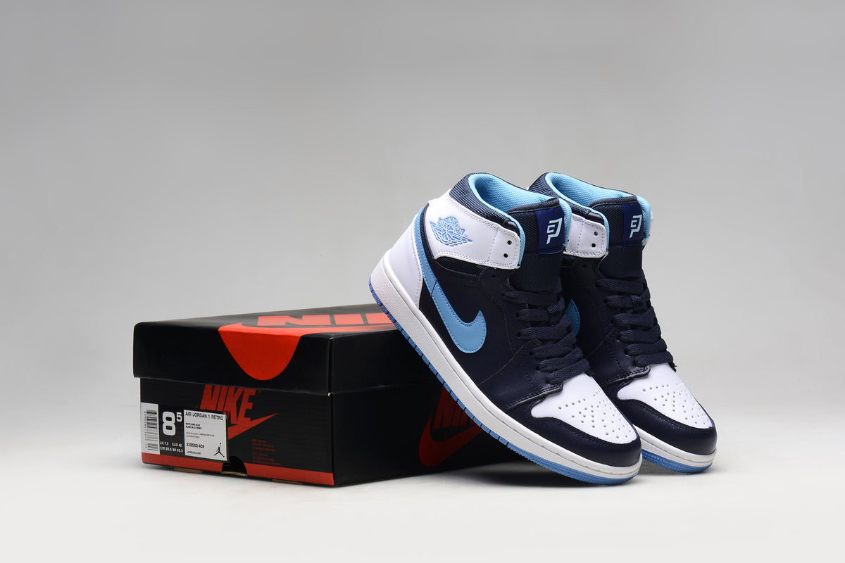 Jordan 1 Retro sneakers beside a shoebox; the photographed box label shows US men’s 8.5 and EU 42