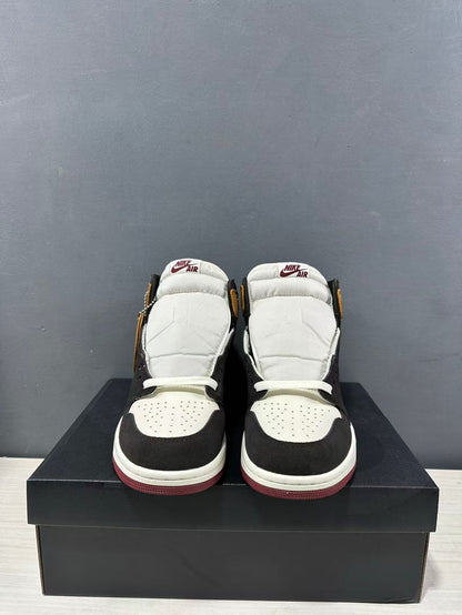 Front view of the pair showing white perforated toe boxes, black toe overlays and padded tongues.