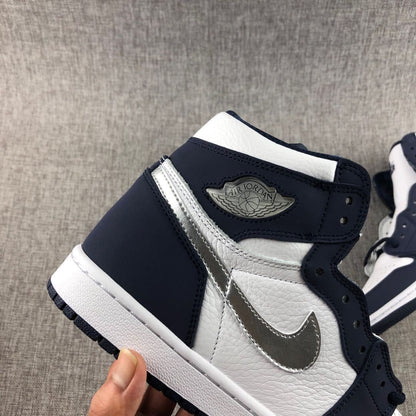 Close-up of the navy ankle collar, silver Swoosh and wing-style ankle emblem.