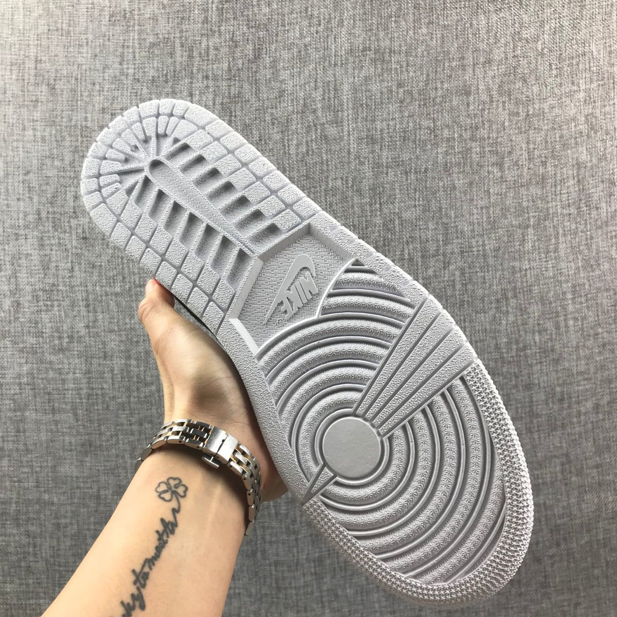 Underside view showing the white rubber outsole and circular traction pattern.