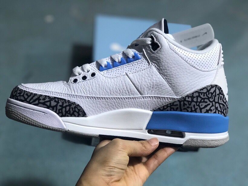 Side profile of a white and blue Jordan 3 Retro sneaker
