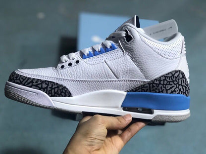 Side profile of a white and blue Jordan 3 Retro sneaker