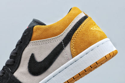 Close-up of the lateral side showing the black Swoosh, light side panel, and yellow heel.