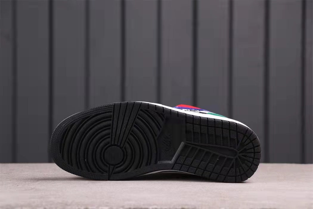 Bottom view showing the black rubber outsole with circular and geometric tread patterns.
