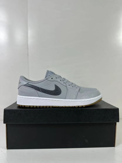 Side profile highlighting the grey upper, dark Swoosh, white midsole, and gum outsole.