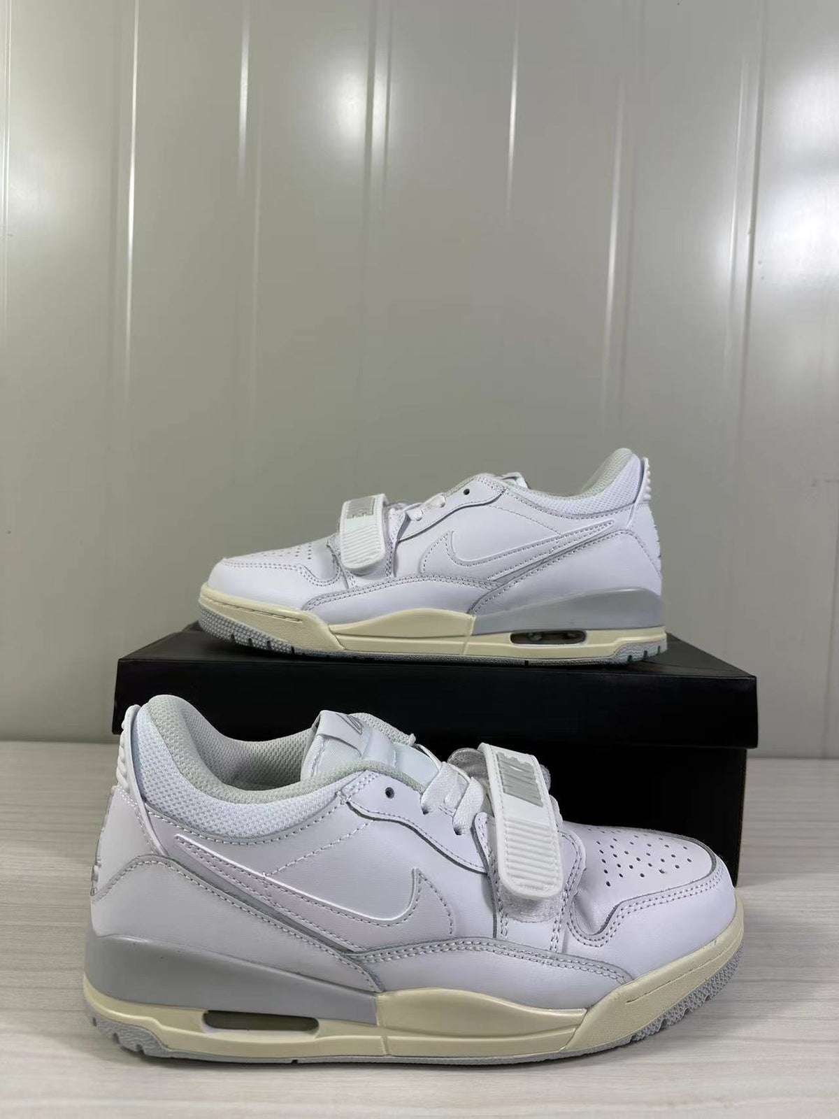 Close side view showing the perforated toe, forefoot strap, layered side panel, and padded collar.