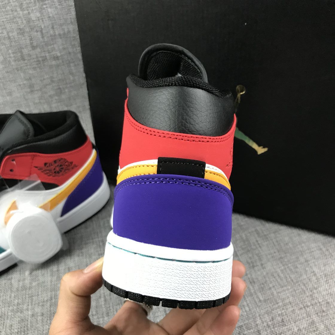 Close rear view showing the black collar, red heel section, purple heel panel and white midsole.