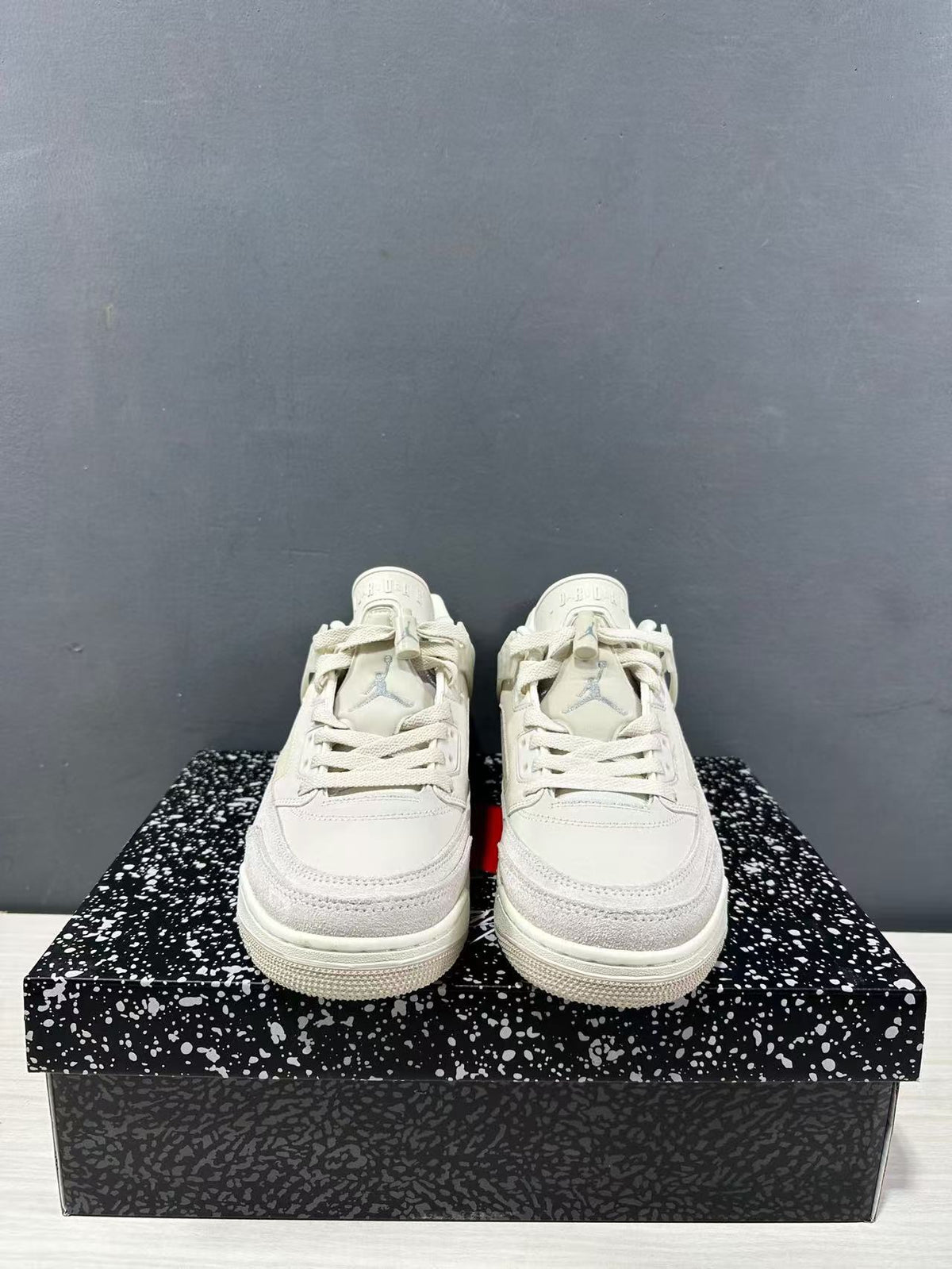 Front view showing the lace-up closure, layered toe panels, and tongue branding.