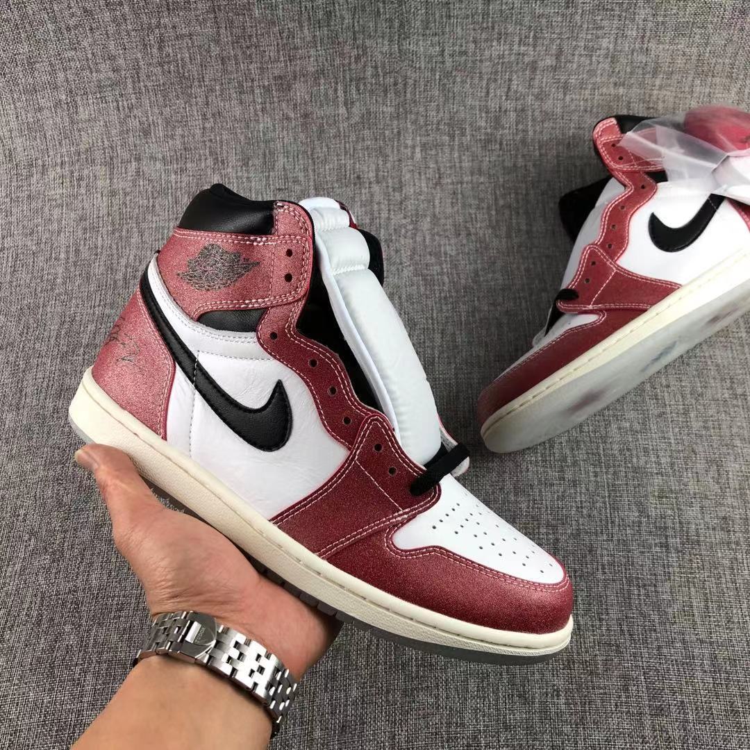 Three-quarter view of the red, white and black high-top sneaker.